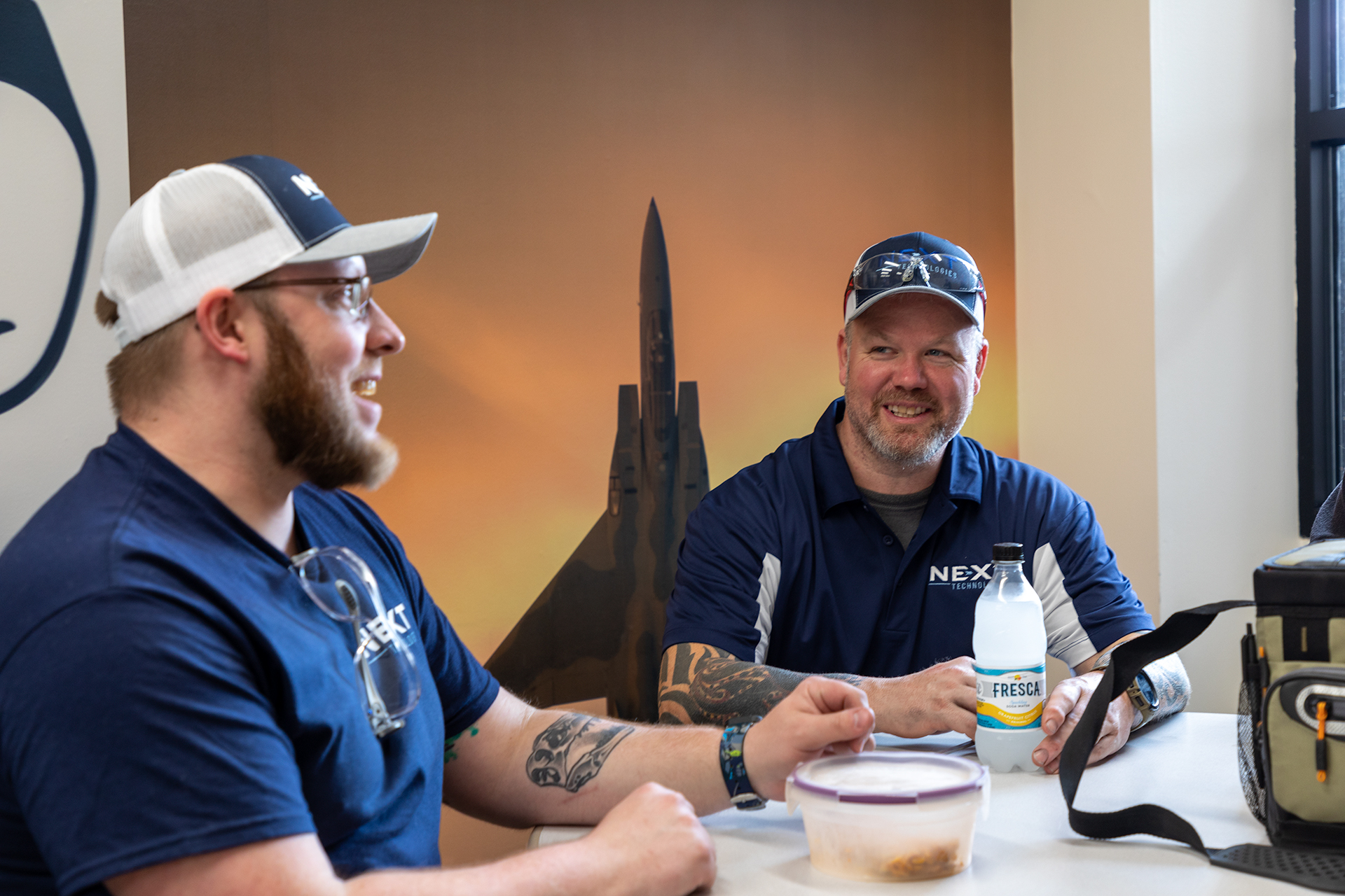 2 men talking at table about core values